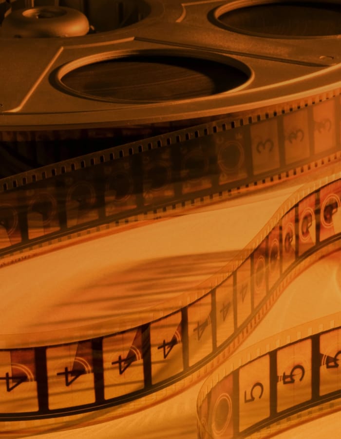 Une icône représentant un clap de film, symbolisant un long montage vidéo et un échange de visage.